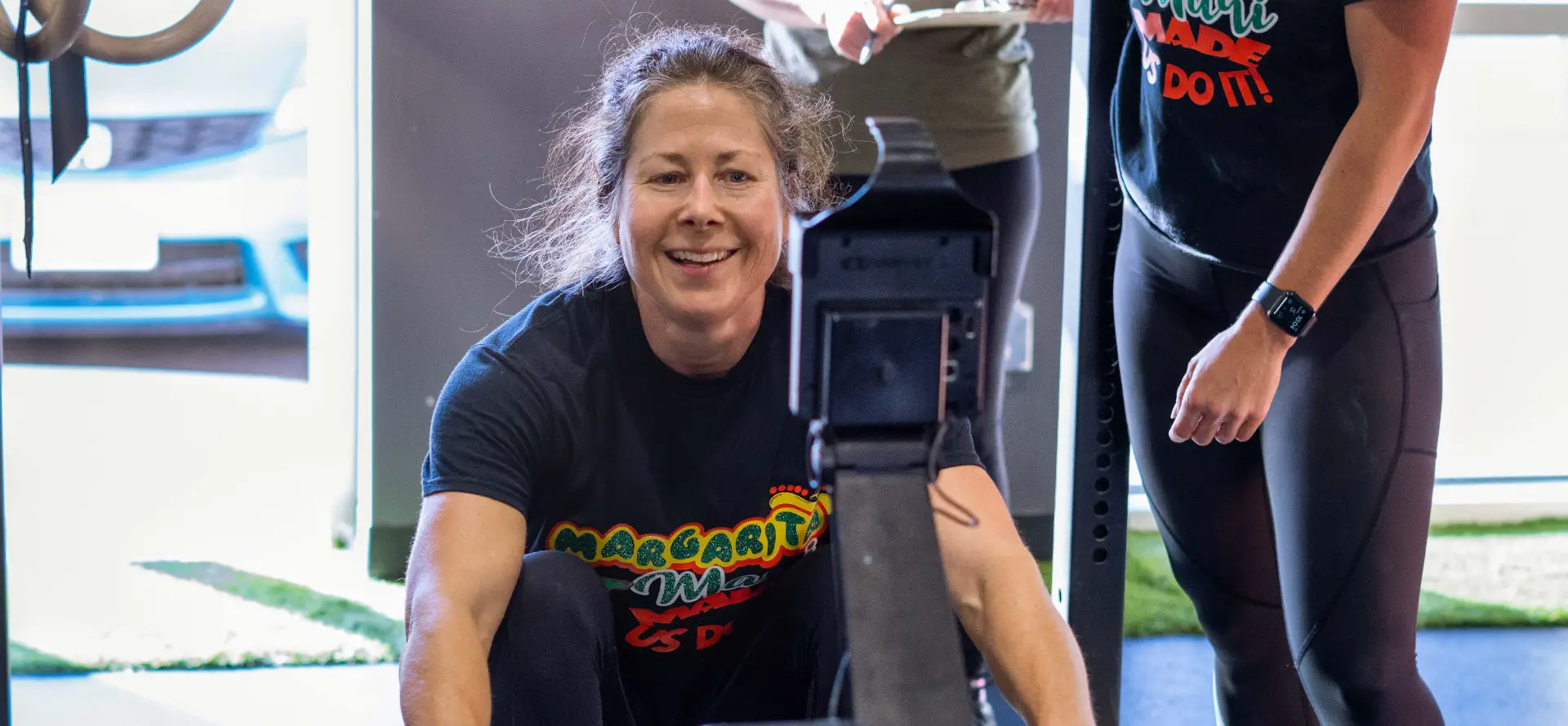 Member on a rowing machine during a CrossFit class at Orleans CrossFit